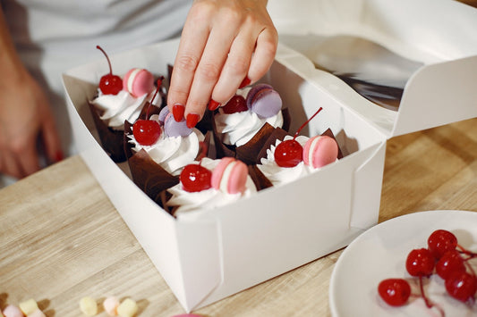 White cupcake box with a window and a fitted insert holding six cupcakes